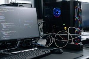Computer, monitor, keyboard, cables, coding.