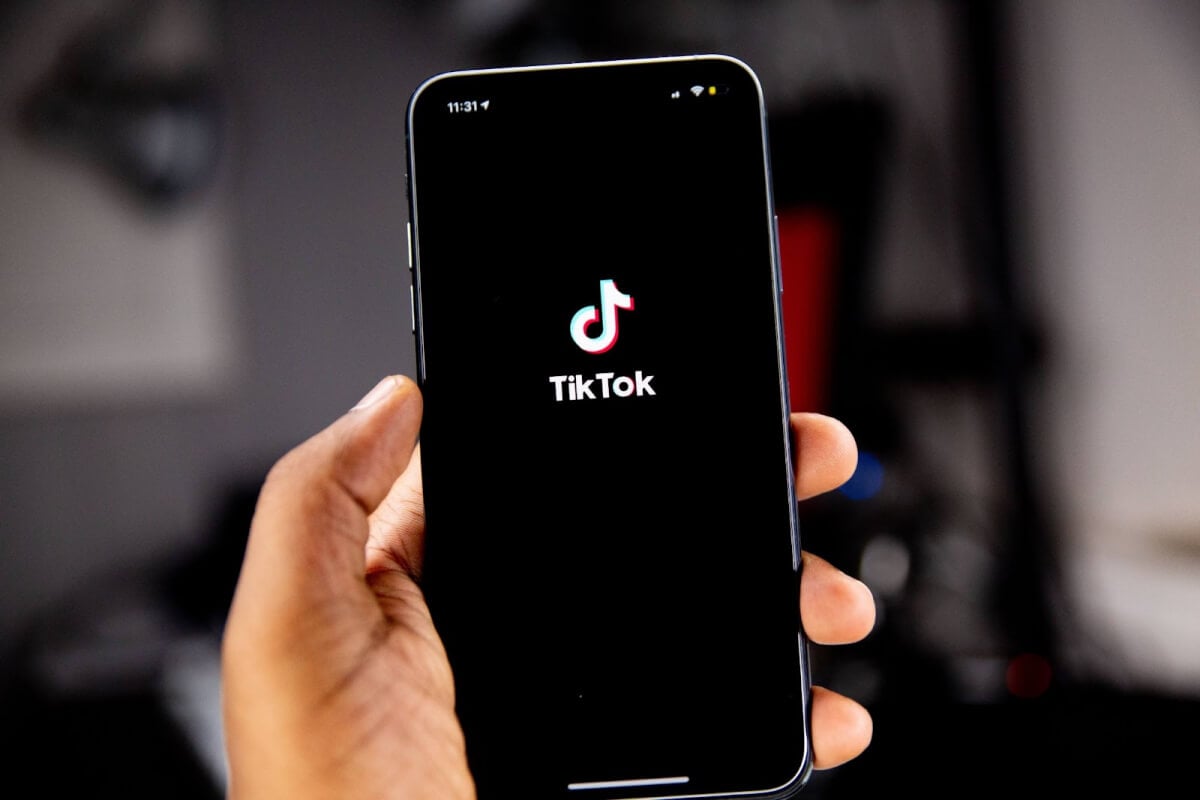 A smartphone displays the TikTok logo